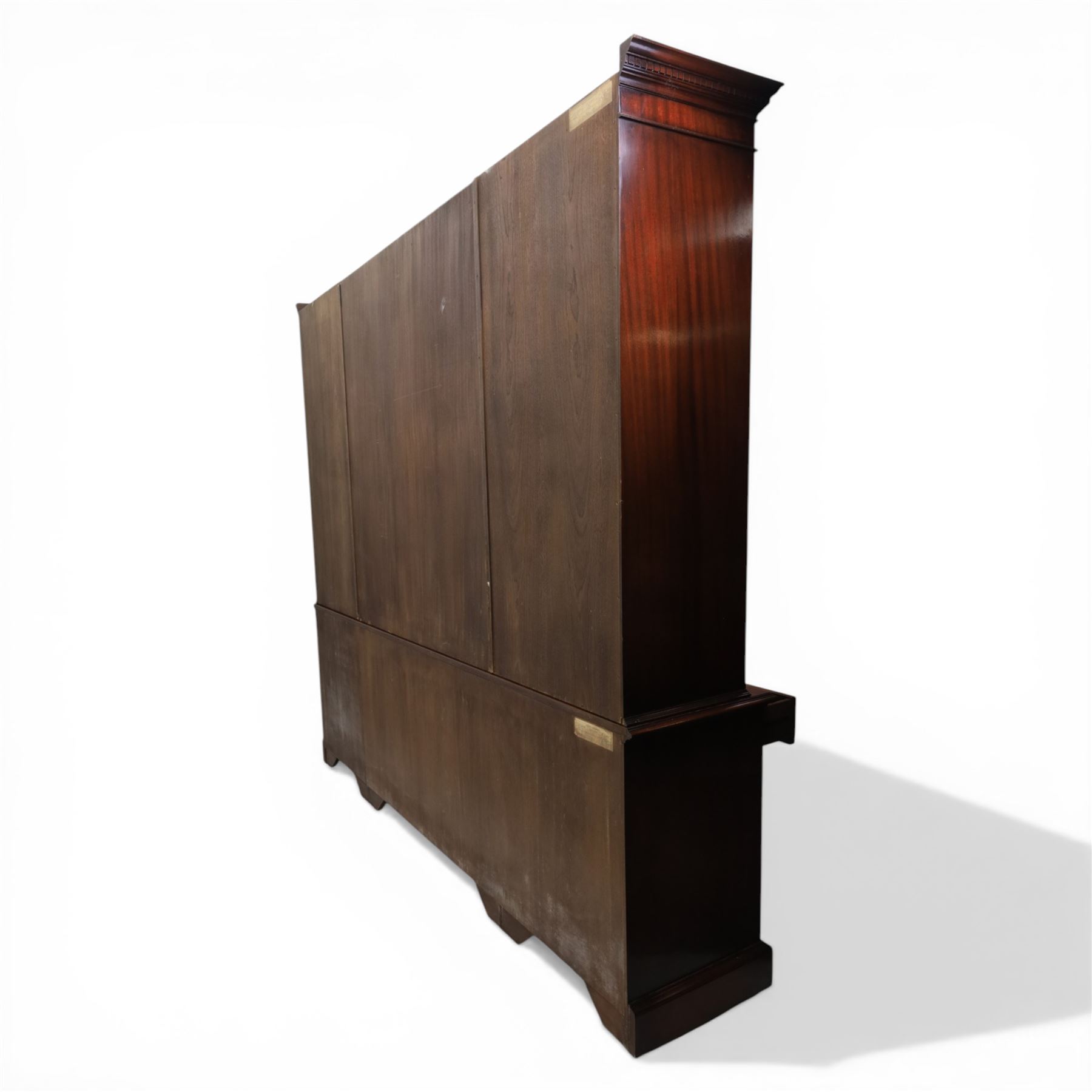 Wade Furniture - Georgian design mahogany breakfront bookcase cabinet, featuring four astragal glazed doors, above eight drawers and two cupboards, one fitted cutlery drawer