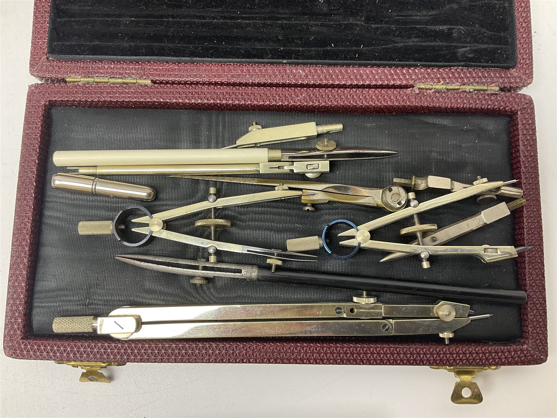 Pair of turned wooden goblets, six hardstone eggs, vintage slide rule and a leather letter rack, etc