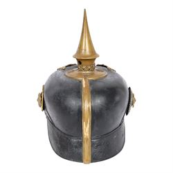 WWI Prussian Pickelhaube, Baden Infantry Regiment, the black leather skull with detachable brass spike, the circular base plate set with four star retaining studs, brass eagle helmet plate, both sides with red and black cockades