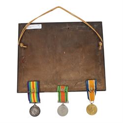 WWI medal trio; Victory medal, 1914/15 star and War medal, framed, together with WWI medal pair; victory and defence medals, awarded to 5832 Pte J Wilson North'O Fus, and WWII Defence Medal, framed