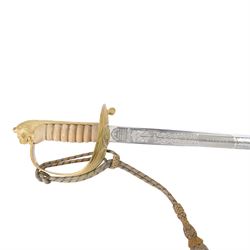 British 1827 pattern Naval officer's sword, named, by Wilkinson Sword Company in 1920 for P.H. Earle and retailed by Gives, the 80cm slightly curved blade etched to both sides, the brass guard held into scabbard by patent spring clip, lion head pommel and backstrap, with sword knot, within leather scabbard with three brass mounts, twin suspension rings and attached belt and suspension straps with gilt buckle and braid, overall L98cm 