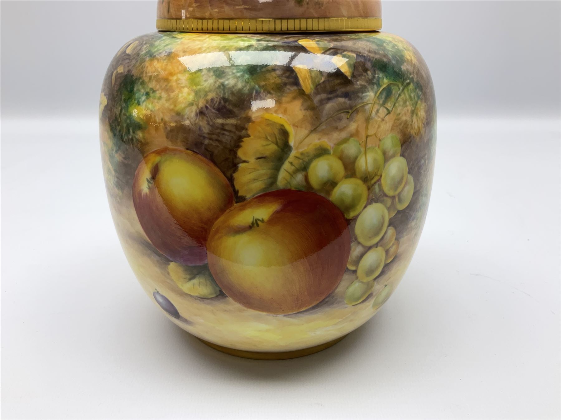 Mid/late 20th century Royal Worcester ginger jar and cover decorated by R Lewis, hand painted with a still life of fruit upon a mossy ground, signed R Lewis, with black printed mark beneath and painted shape number 2826, H17.5cm