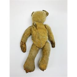 Early 20th century American mohair teddy bear c1920 with wood wool filled body humped back body with jointed limbs, black boot button eyes and horizontal stitched nose and mouth H12