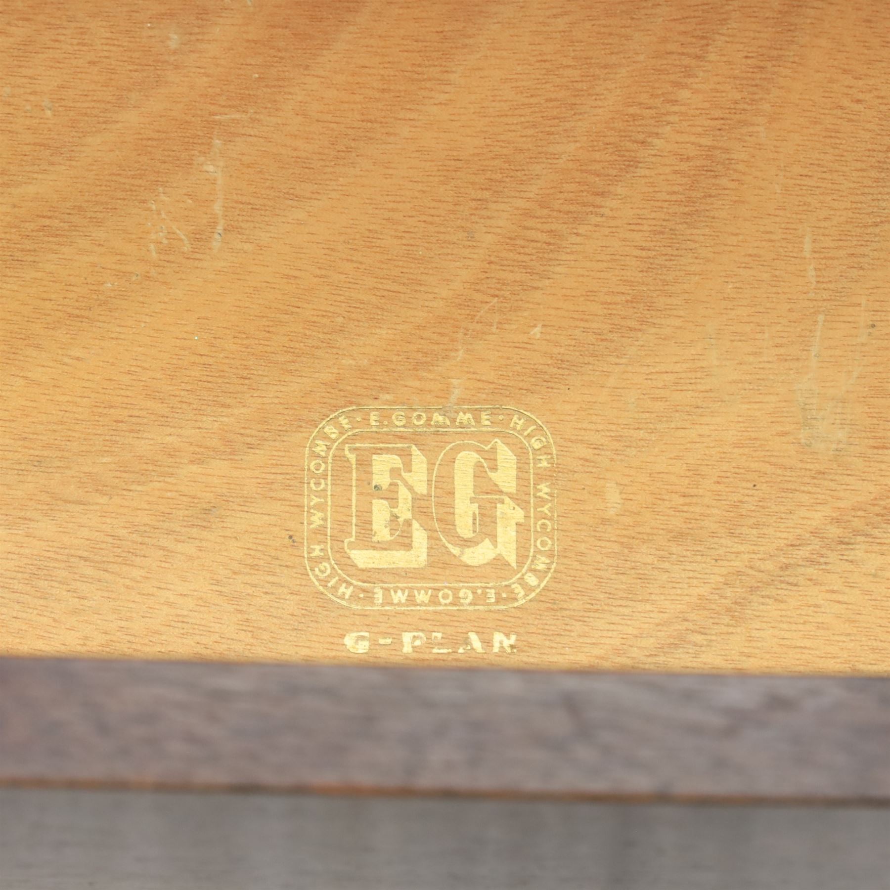 G Plan - ‘Librenza’ tola wood sideboard, the rectangular top above two cupboards to either side and three graduated central drawers, the drawer and door fronts veneered in figured tola wood with brass handles, standing on splayed tapering legs