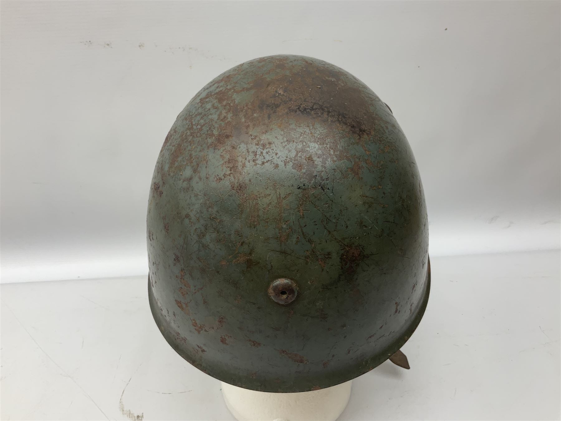 WWII Italian steel helmet with liner and chin strap