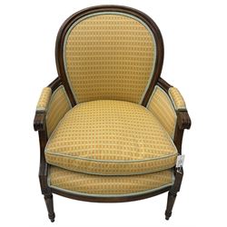 French design hardwood-framed armchair, moulded frame, upholstered in pale orange geometric design fabric, on turned and fluted feet