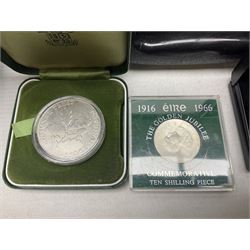 The Royal Mint United Kingdom 1977 silver proof two coin set, Queen Elizabeth II 2002 silver proof three coin set, comprising Bailiwick of Jersey, Bailiwick of Guernsey, and Alderney five pound coins, 'First Coinage of the British Virgin Islands' proof set, 1997 1/10 ounce fine silver Britannia, two King George V 1935 'Rocking Horse' crowns, various Isle of Man commemorative crowns, etc., house in a hard shell carry case