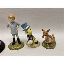 Nine Royal Doulton Winnie the Pooh Collection figures, including Oh Dear Bath Time's Here, Going Sledging, Tigger's Splash Time and Christopher Robin, together with a Royal Doulton Disney Showcase Jiminy Cricket figure, all boxed