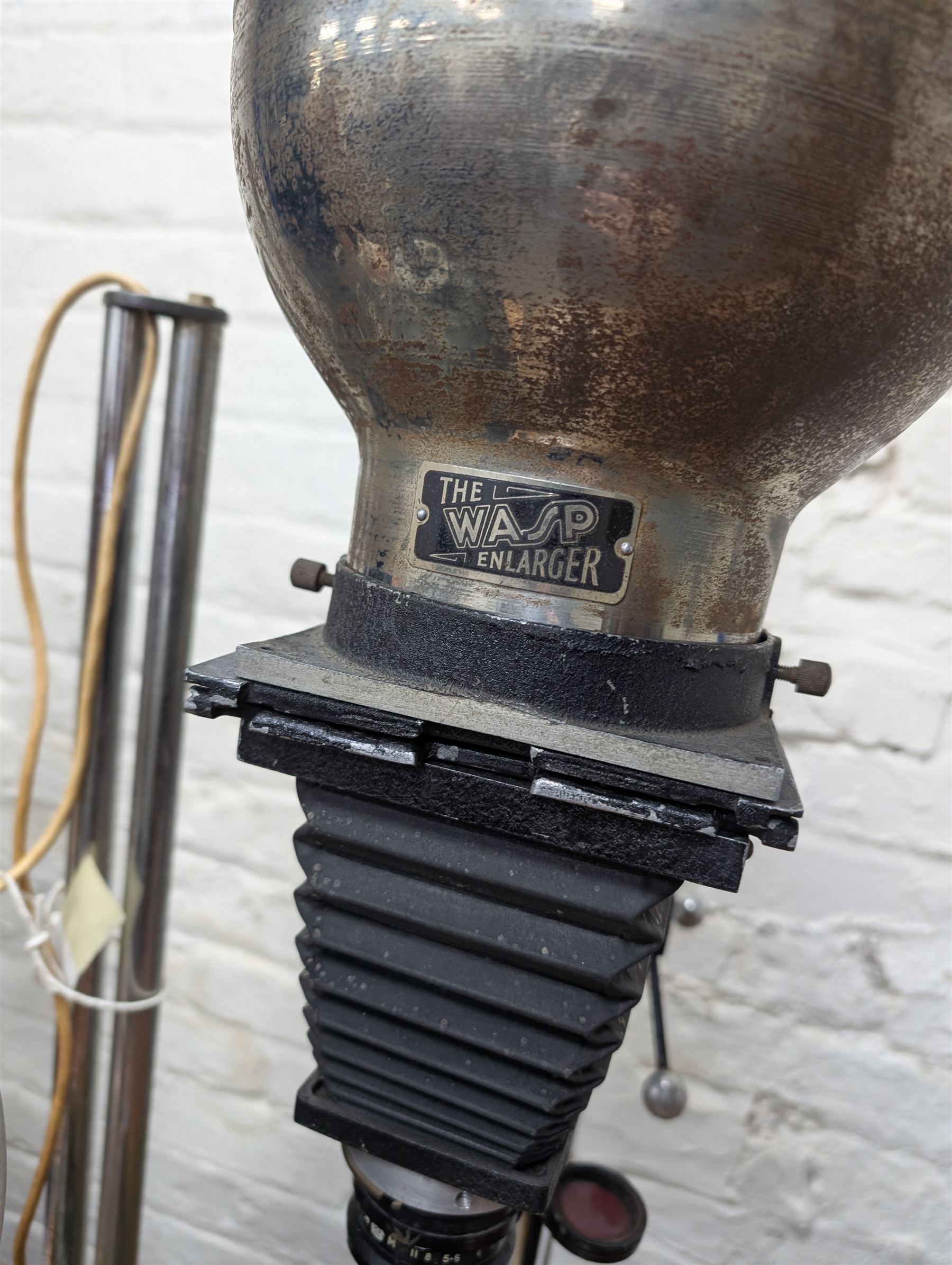 Five mid-20th century photographic enlargers including two The Wasp Enlarger, Paragon Focus-Spot Enlarger, Ensign Standard Enlarger and Lancaster tin plate example 