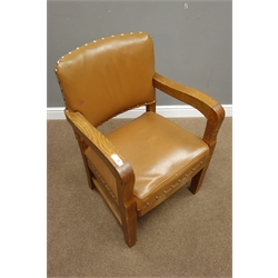  Mid 20th century oak armchair with sprung seat upholstered in tan leather with stud detailing, W61cm  