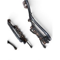 Carron Foundry - two pairs of 19th century cast iron garden bench ends, ornate detail with arms and X shaped legs,finish in black paint, the design no. 110396, first registered 13 July 1857 (see illustration), width as desired