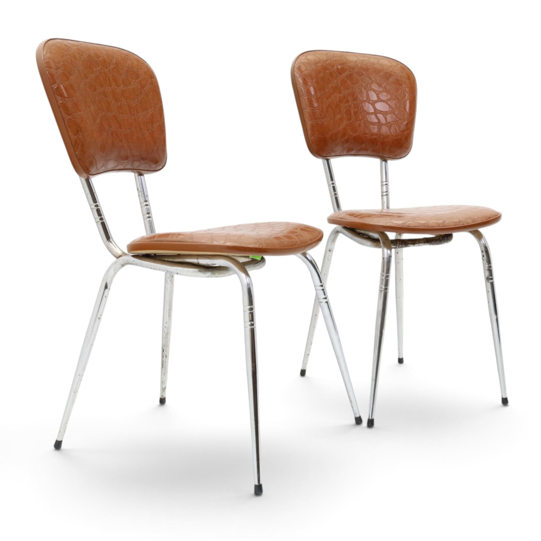 Pair of 20th century French chrome and crocodile effect bistro chairs, shaped padded back and seat upholstered in mock-croc faux leather on tapering chrome supports