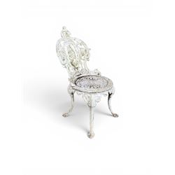 Pair of white painted cast metal garden chairs, ornate reclined backs, circular pierced seats on cabriole legs