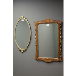  19th century mahogany framed mirror carved gilt foliate, (51cm x 73cm), and a small oval bevel edged wall mirror with gilt frame, (35cm x 67cm)  