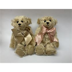 Group of five teddy bears comprising ‘George’ a unique pellet filled bear with glass eyes and velvet paws H38cm, and ‘Abbey’ a luxury German plush with wobble head and glass eyes no.5/10 H24cm, both with Teddies from Bearyland labels; along with two light blonde mohair H. M. Bears and Boyds Bears ‘T. F. Wuzzies’ no. 595140 (5)