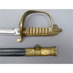  George Vl Naval officers dress Sword, wire bound sharkskin grip with Lionshead pommel, with lock, 79cm blade etched with fouled anchor, No.0256, in leather & brass scabbard with cotton case labelled  'OHMS Comr. W. E. Mahoney. RN, Wocester Park, Via Waterloo, L'Pool St', leather belt with gilt buckle, L95cm  
