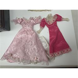 Early 20th century scratch-built wooden hat & gown shop diorama 'Joan', of double-fronted form glazed on three sides with brass and aluminium mounts, rear access apertures and storage under L63cm H45cm D31cm; with small collection of dresses and hats on display stands