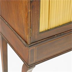 Regency period mahogany waterfall-bookcase chiffonier, the raised back with two open shelves supported by central ring-turned pilasters, fitted with twin doors with sage-green pleated fabric facias, over two drawers with satinwood stringing, raised on front sabre supports
