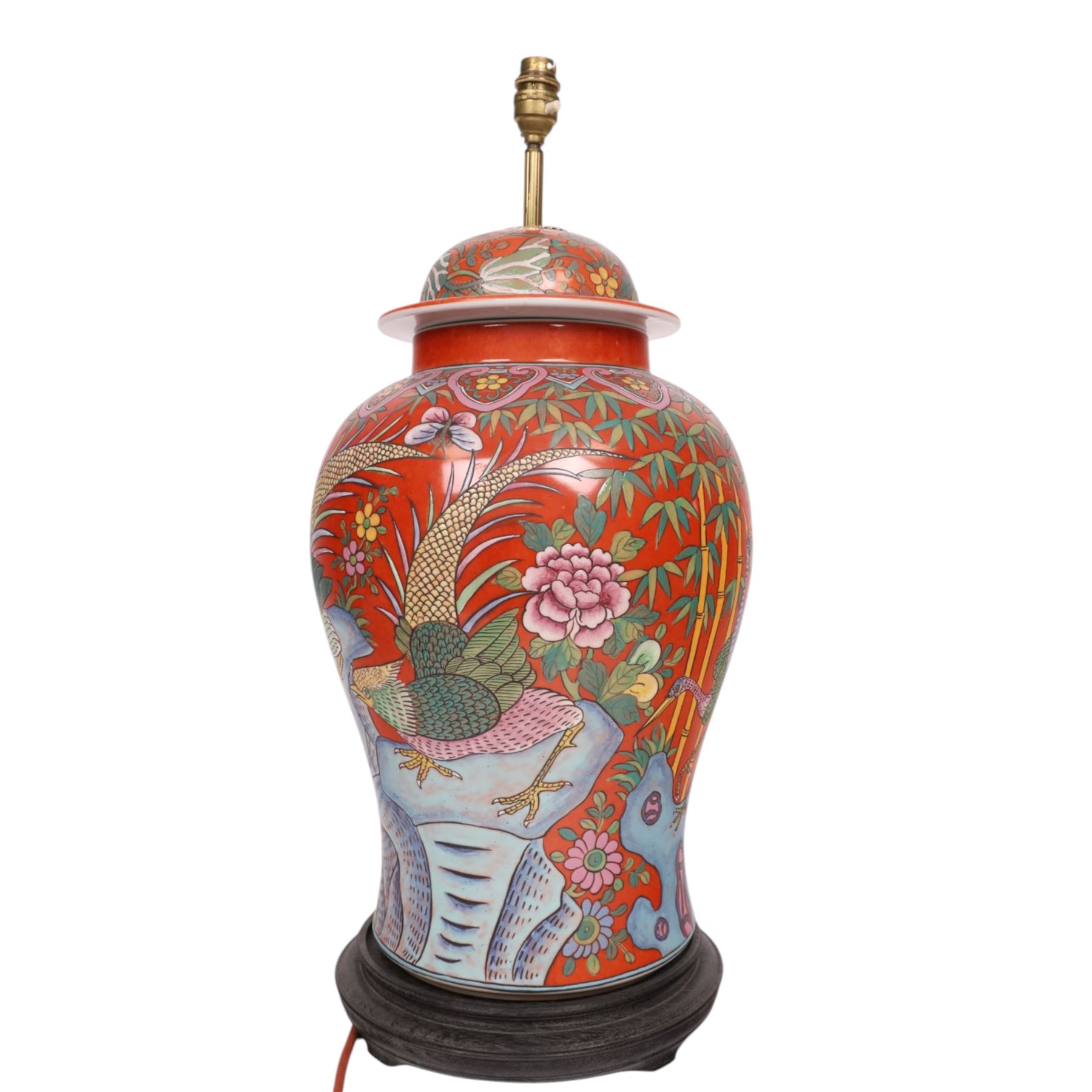 Table lamp of baluster form, decorated with ducks and lilies upon a red ground upon a circular wooden base, H64cm