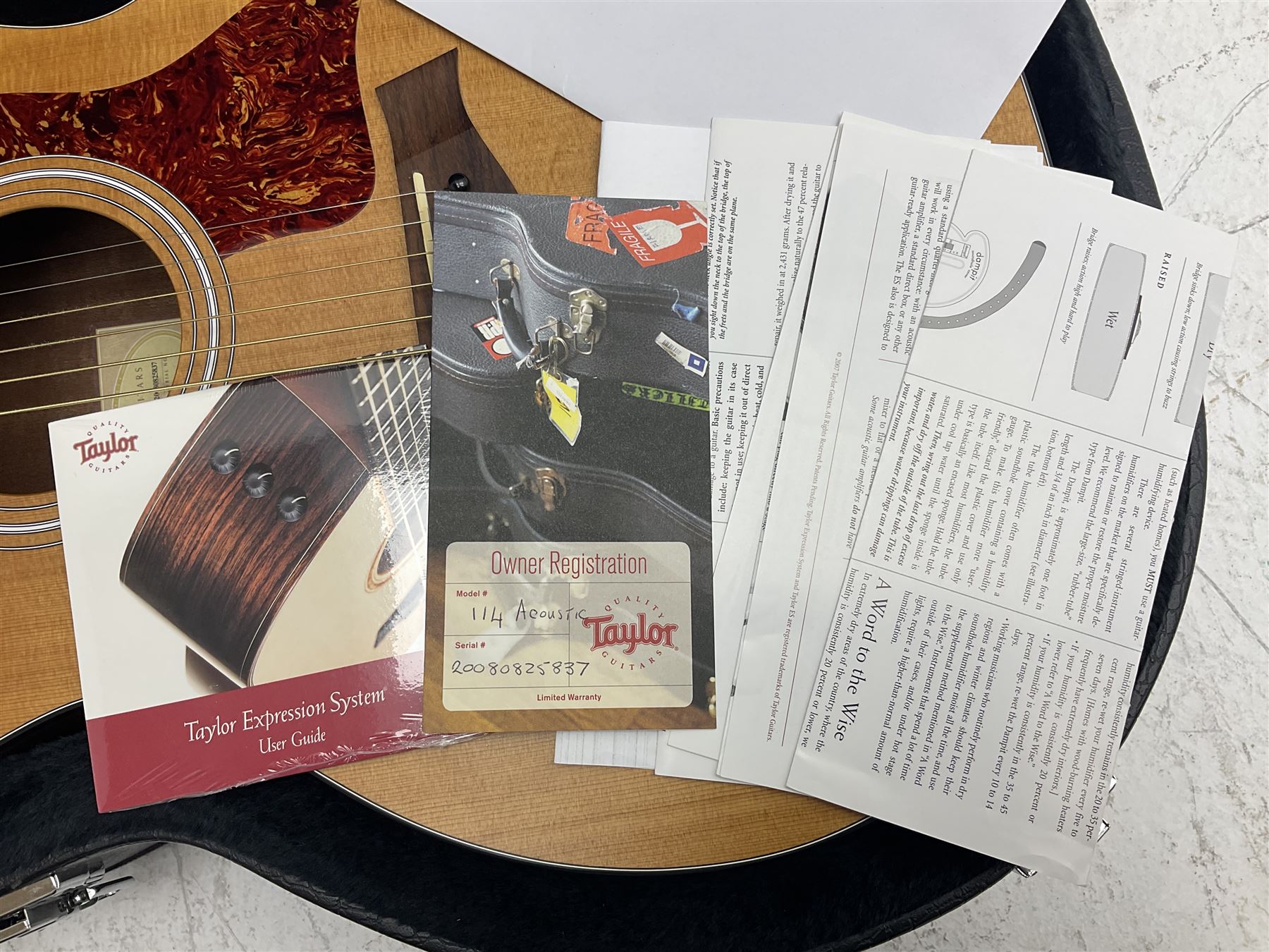 2008 Taylor Model 114 acoustic guitar with mahogany back and ribs and spruce top, serial no.20080825837, L104.5cm; in Taylor hard carrying case with paperwork
