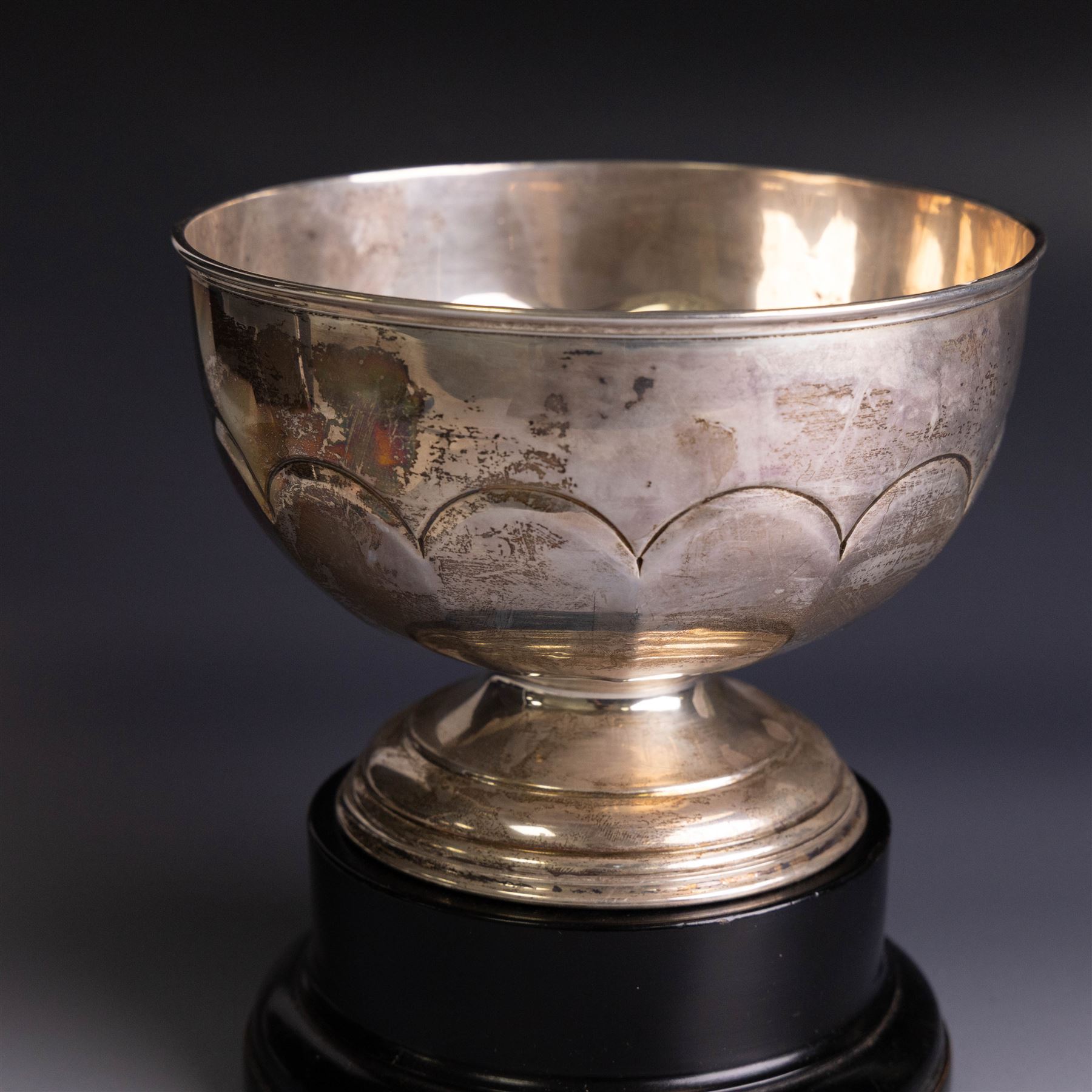 Edwardian silver pedestal bowl, of part fluted circular form, hallmarked Birmingham 1909, maker's marked worn and indistinct, upon an ebonised wooden pedestal, bowl H11.5cm