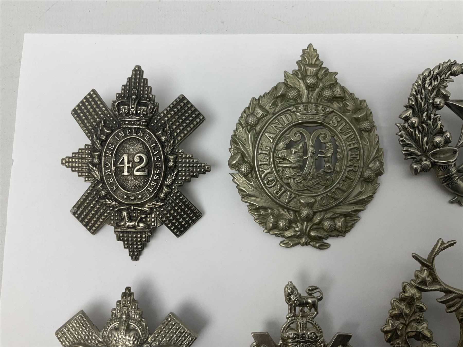 Thirteen Scottish metal Glengarry badges including Black Watch, Highland Regiment, Cameronians, Argyll & Sutherland, Seaforth Highlanders, Kings Scottish Own Borderers etc