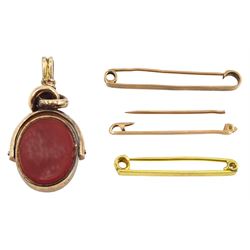 Early 20th century 10ct gold bloodstone and carnelian swivel fob, stamped and three 9ct gold tie pins, all stamped or hallmarked