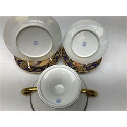 Noritake tea service for four, decorated with desert camel scene with blue border and gilding, comprising four teacups and saucers, four side plates, lidded sucrier, teapot and jug, together with twin handled pedestal bowl etc (19 pcs) 