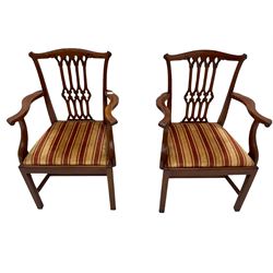 Set six Georgian design mahogany dining chairs, shaped cresting rail over pierced splat, drop in seat cushion upholstered in striped fabric, on square supports joined by H stretchers, two carvers and four side chairs 