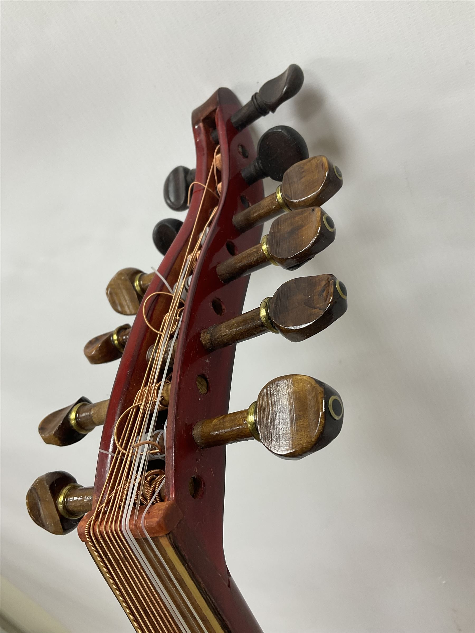 20th century Middle Eastern six string lute with a segmented back and a purpose designed hardwood stand