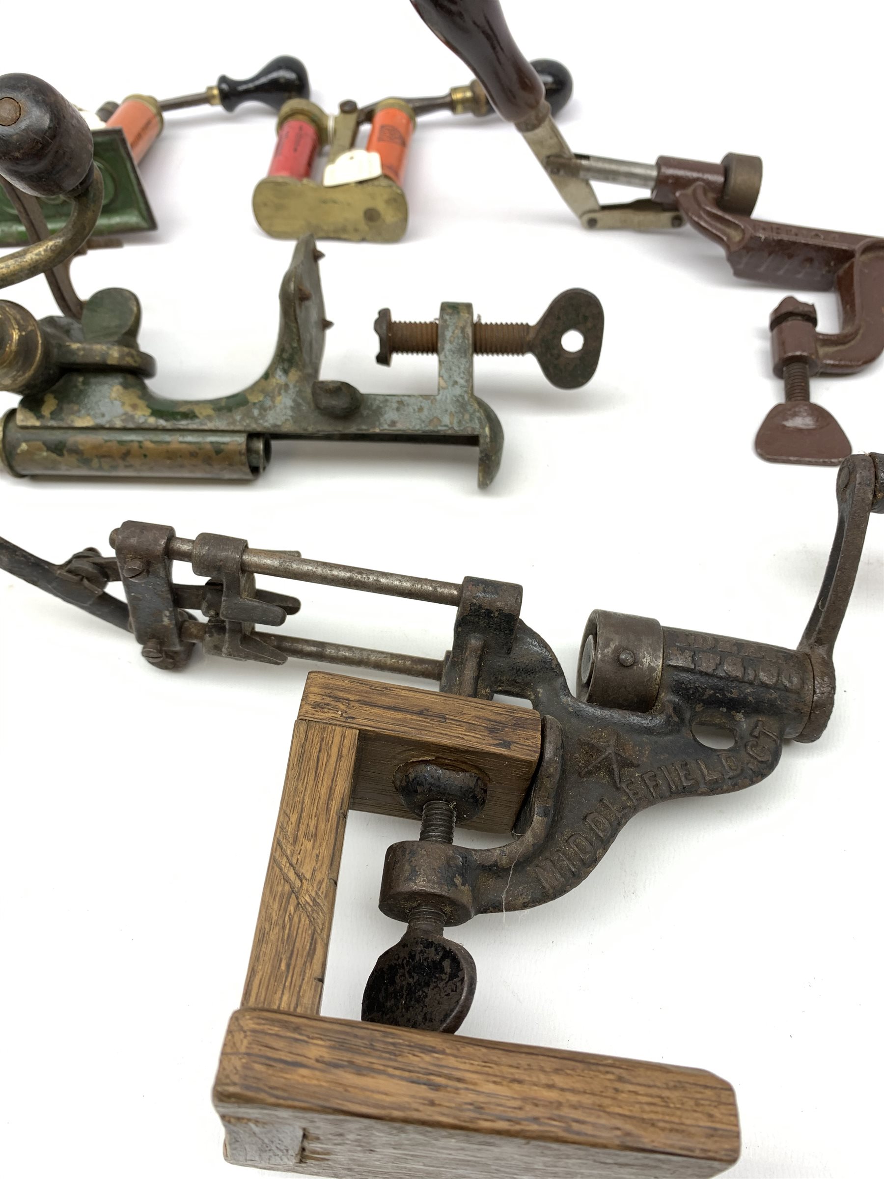 19th century and later predominantly 12-bore cartridge making equipment including American Ideal Mfg. Co. Middlefield Ct. re-loader, unmarked brass re-loader, Berica crimper, James Dixon and Webley recappers, Wm. Powell & Son Birmingham oil bottle, turned wooden rammer etc; and green metal cartridge carrying case