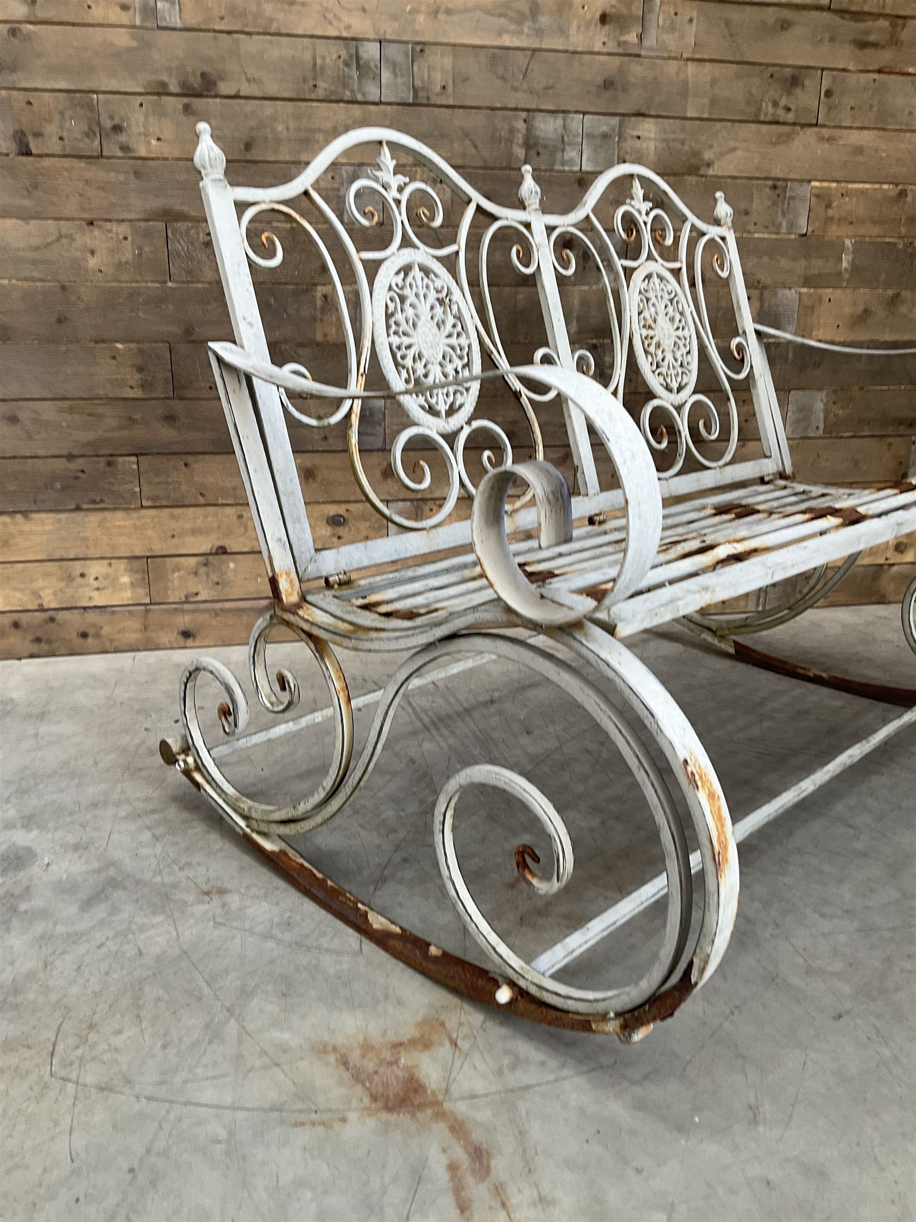 Wrought metal rocking garden bench seat, in antique grey finish