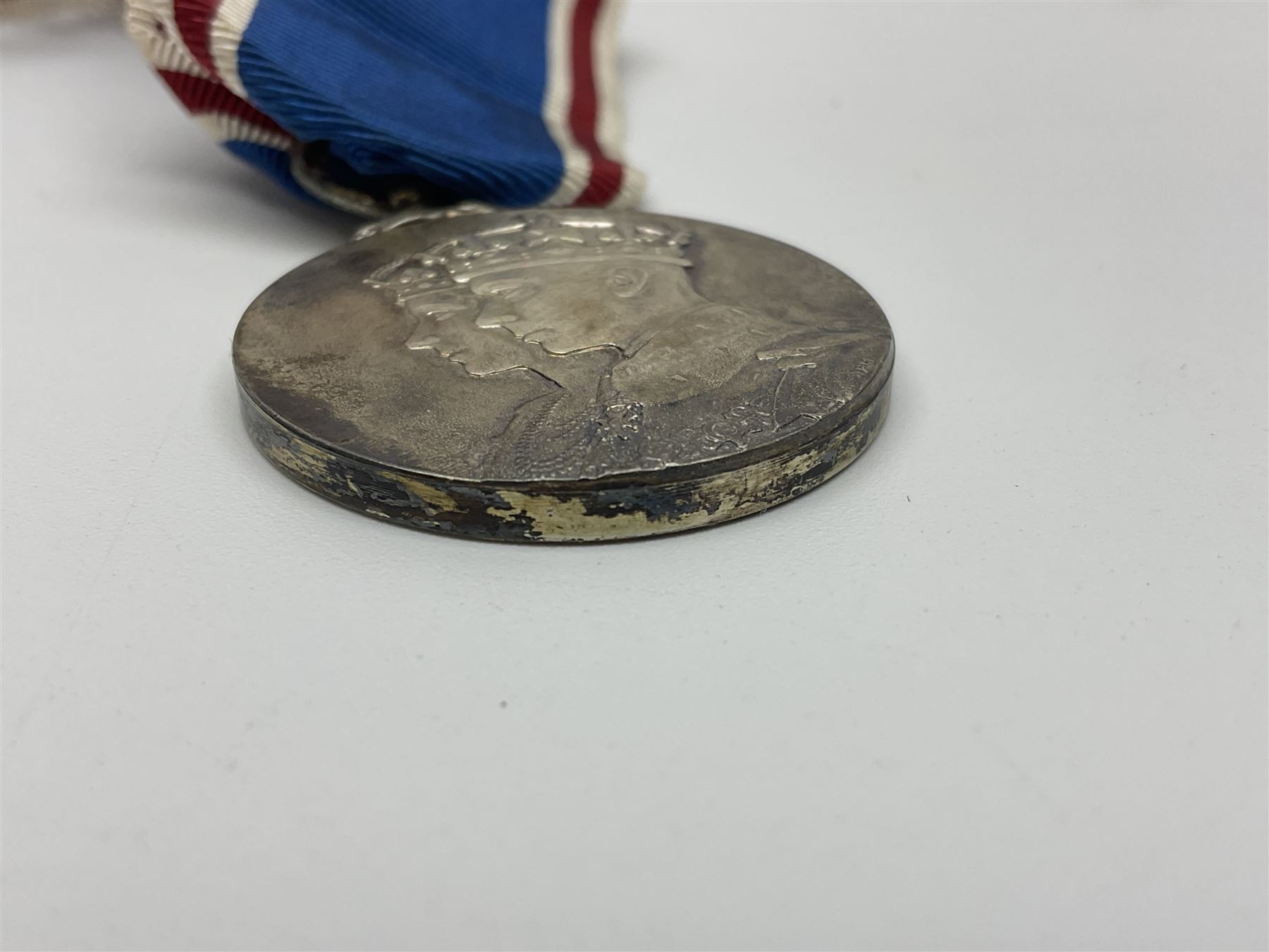 Collection of WW2 and police medals c.1933-1955, awarded to Eric Drinkwater comprising 1939-45 War Medal, Defence Medal, 1939-45 Star and Burma Star, on wearing bar; 1918-62 General Service Medal with Cyprus clasp to P.S. E.G. Drinkwater; boxed; Police Long Service and Good Conduct Medal to Const. Eric C. Drinkwater; cased; Royal Life Saving Society bronze medal to E.C. Drinkwater July 1933; boxed; and George V 1937 coronation medallion; boxed.