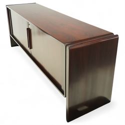 Dyrlund  - contemporary Santos rosewood office sideboard of minimalist form with clean lines, rectangular top with integrated side supports, left side with two drawers, and right side with a filing drawer, all enclosed by sliding doors


Note: Dyrlund is a Danish furniture manufacturer known for its high-quality, handcrafted pieces, particularly in the mid-century modern style. Founded in 1960 by Frits Hjerte Dyrlund in Rude, Denmark, the company has remained a family business, now run by the second and third generations. Dyrlund specializes in both home and executive office furniture, focusing on practicality, solid construction, and classic design. 
