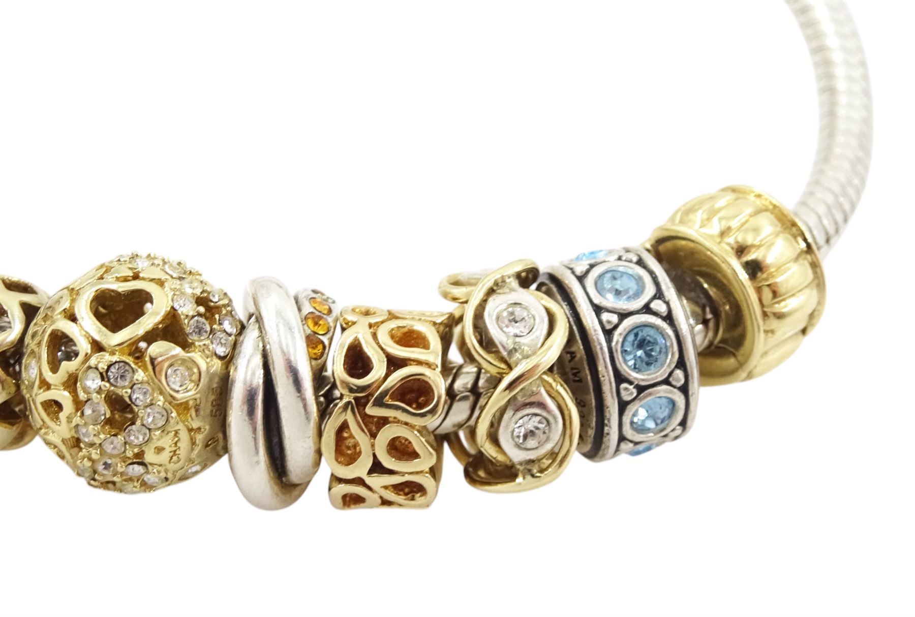Chamilia 14ct gold and silver charm bracelet, silver bracelet, with 14ct gold and silver finials, six 14ct gold charms including cubic zirconia, four silver charms and two silver and 14ctgold charms, boxed
