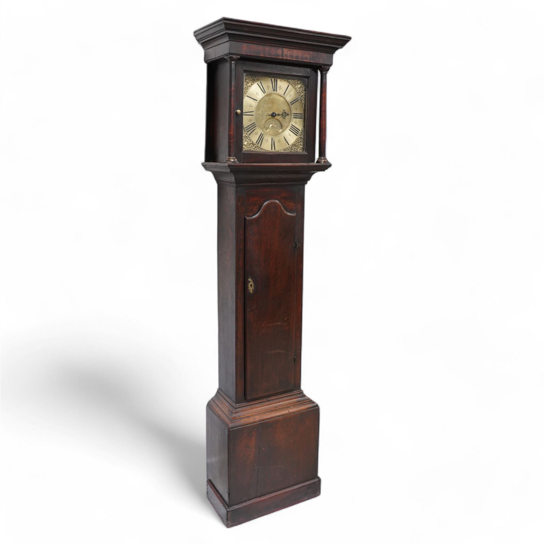 Cooper of Derby - Early 18th century 30hr oak longcase clock c1740, with a flat topped hood and plain frieze beneath, square hood door flanked by turned pilasters with wooden capitals, long trunk door with a wavy top on a square plinth with applied skirting, brass dial with cast spandrels and an engraved dial centre, chapter with Roman numerals, quarter hour markers, single steel hand and date aperture, chain driven countwheel striking movement, sounding the hours on a bell. With weight and pendulum.