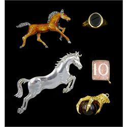  Gold tiger's eye eagle claw pendant, gold 10 money note charm and a gold black onyx signet ring, all hallmarked 9ct, silver and enamel horse brooch and one other silver jumping horse brooch
