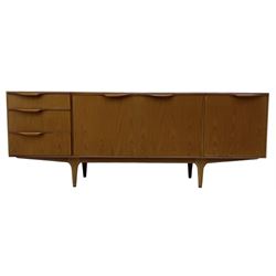 McIntosh - mid-20th century teak sideboard, fitted with three drawers, double cupboard and fall front, on tapering supports