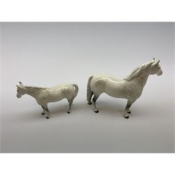 A Beswick figure of a horse, Welsh Cob, model no 1793, together with another similar Beswick example, each with printed marks. (2). 