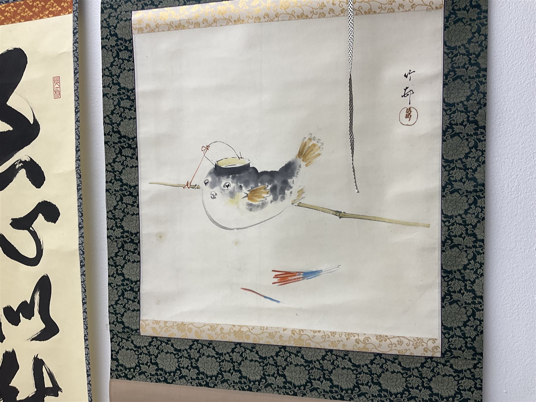 Two 20th century Japanese kakemono, the first example depicting a puffer fish, the second with Japanese Calligraphy 