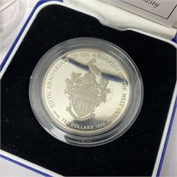 Mostly commemorative coins, including two Queen Elizabeth II 1977 silver proof crowns both cased with certificate, Barbados 1998 silver proof ten dollars cased with certificate, various commemorative crowns many in plastic displays, modern Masonic interest medallions etc