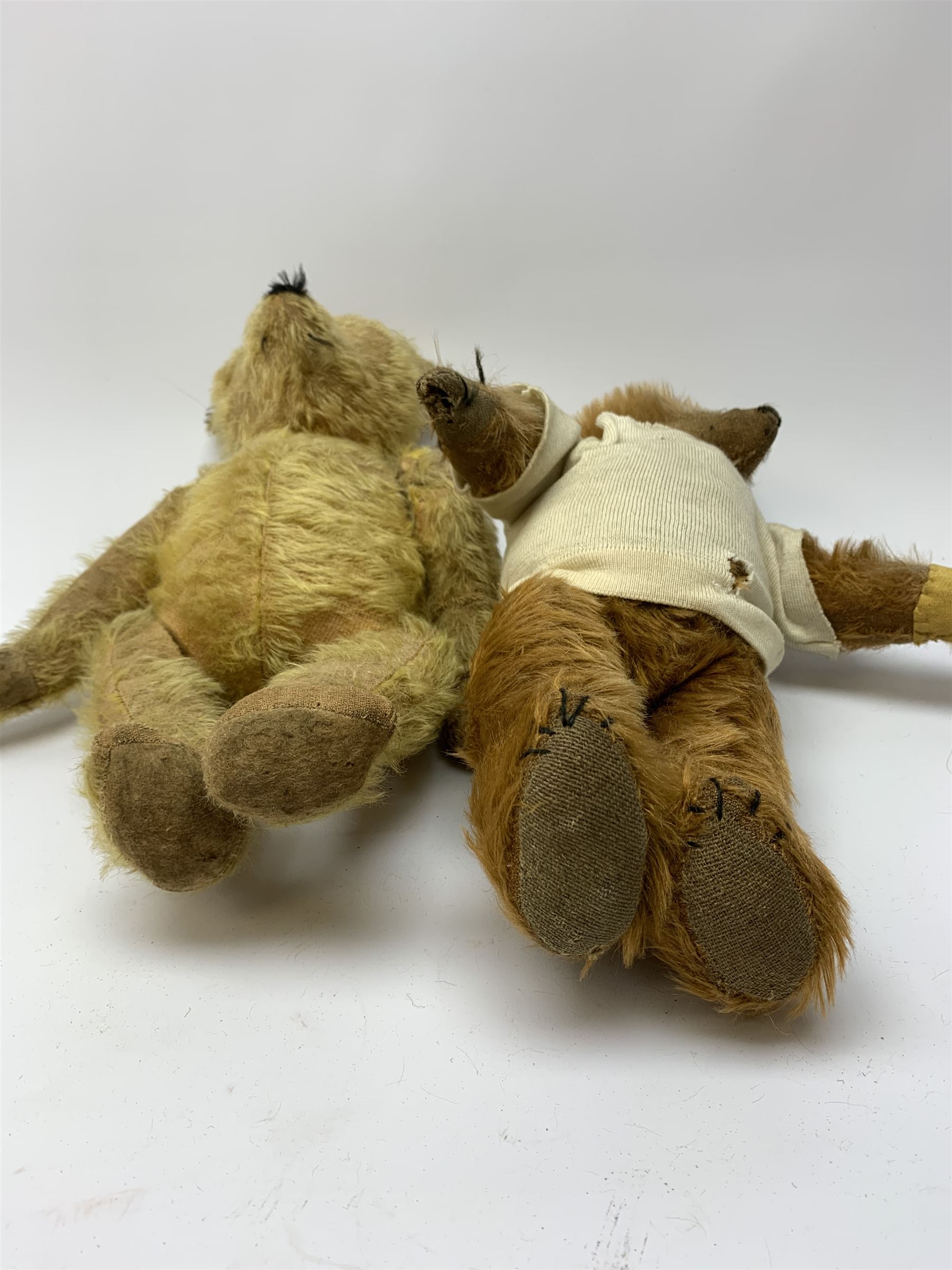 Early 20th century cinnamon coloured bear c1920, possibly continental, with unusual hedgehog styled head/face, swivel jointed head, wood wool filled body with jointed limbs, five claw stitches to feet  and inoperative growler mechanism H16