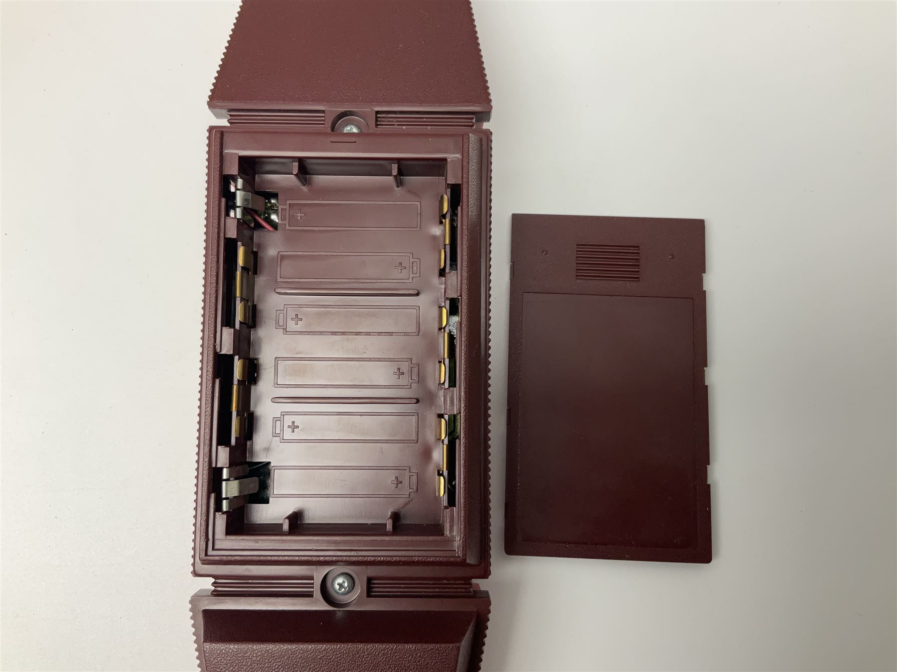 Three late 70s/early 80s handheld electronic games; Bandai Electronics Arcade ‘Gunfighter’ (1980), Grandstand ‘Invader From Space’ (1980), Palitoy ‘Merlin The Electronic Game Machine’ (1979) with game sheet and instruction booklet, all with original boxes (3) 