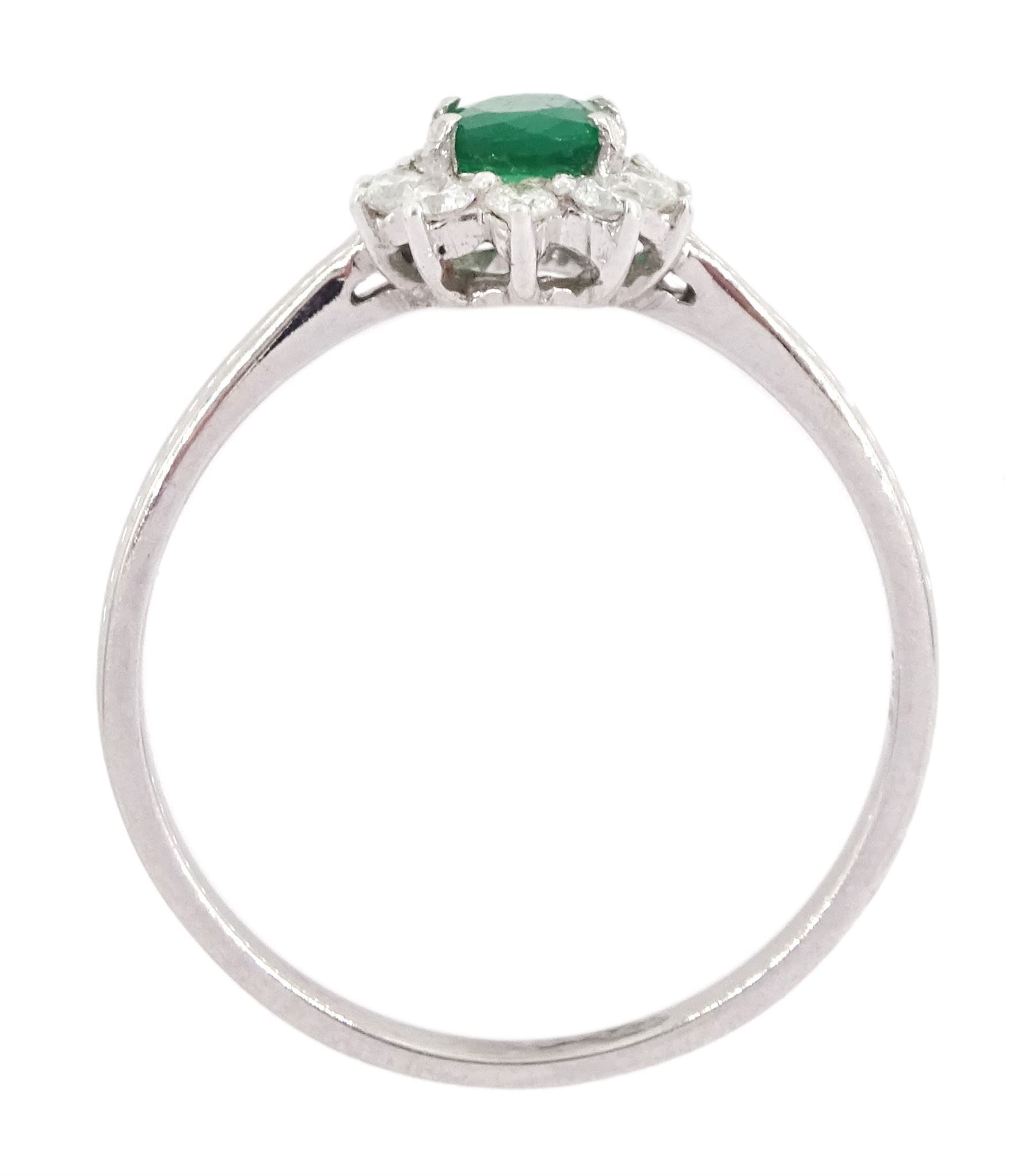 18ct white gold oval cut emerald and round brilliant cut diamond cluster ring, stamped 750