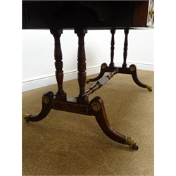  Regency gilt metal mounted brass strung rosewood and simulated rosewood Sofa table, with two fall leaves, two real and two false cockbeaded frieze drawers with brass ring handles on twin turned end supports joined by a stretcher on reeded cabriole legs with brass sockets and castors, L160cm, W74cm, H77cm max  