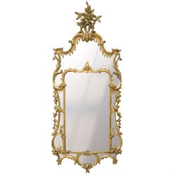 George III Chippendale design carved giltwood and gesso wall mirror, the impressive protruding pierced pediment decorated with flared acanthus leaves interspersed with flower heads and berries, over an arched outer-frame - the cresting comprised of C-scrolls carved with dripping icicle motifs, the uprights formed of scrolling acanthus with swags of grapevines and foliage, over a scrolled cartouche terminal, the inner-frame of architectural form with bell-flower details and a shaped cresting with scrolling acanthus leaves, all enclosing a central slightly bevelled rectangular mercury glass plate, surrounded by smaller plates