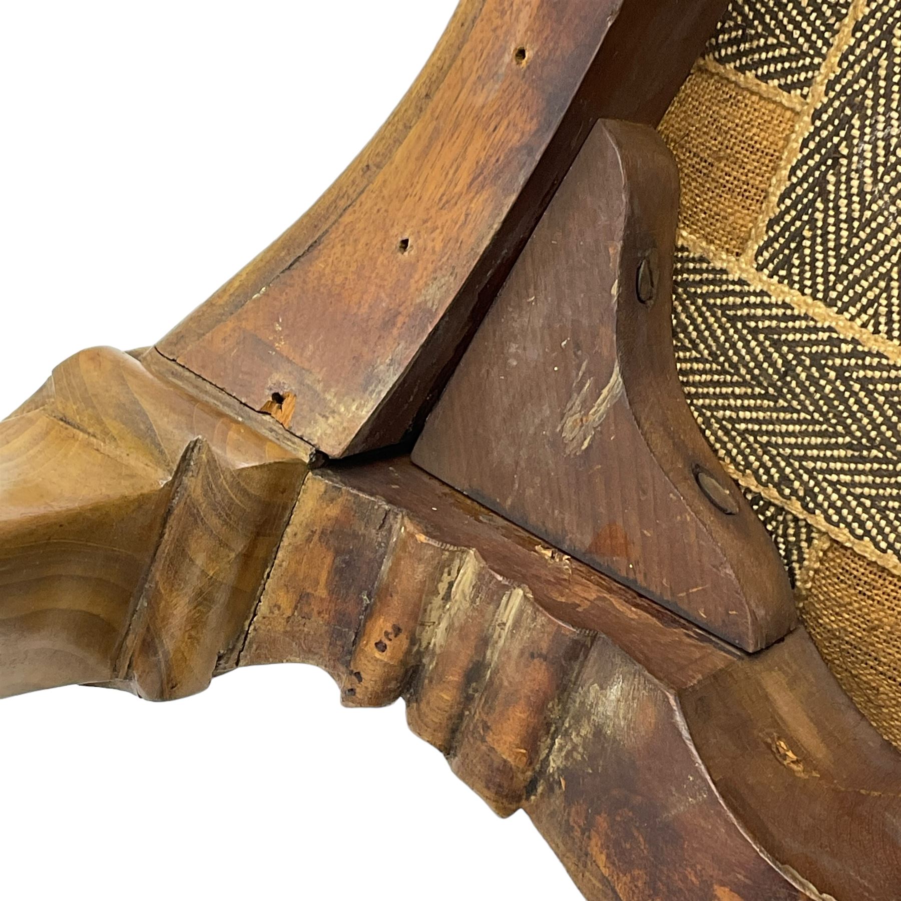 Pair of Victorian walnut side chairs, shaped cresting rail carved with acanthus leaves, overstuffed upholstered seats with stud band, on cabriole supports with scroll carved terminals