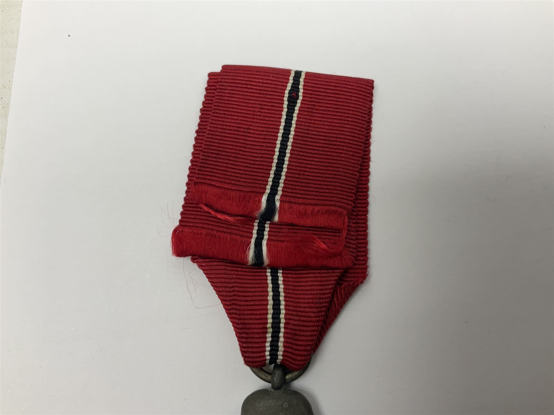 WWII German 'SS' Long Service Medal for four years; Ostfront Medal for the Winter Campaign in Russia of 1941-1942 'Die Medaille Winterschlacht Im Osten'; and War Merit Cross 2nd Class with swords; all with ribbons (3)