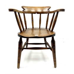 Early 20th century elm smokers bow armchair, turned supports joined by double 'H' stretcher