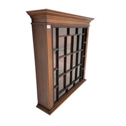 Early 20th century mahogany wall hanging cabinet, projecting cornice over single astragal glazed door
